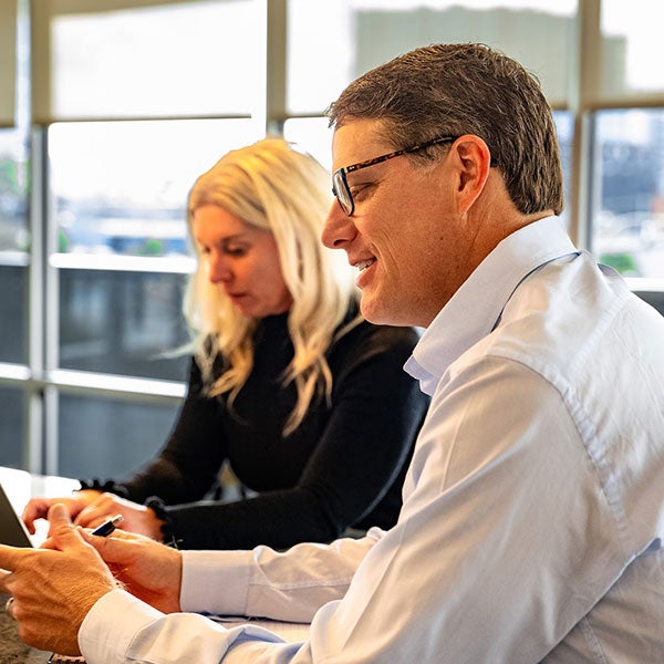 Two team members working together