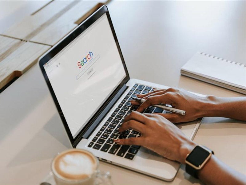 A person searching on Google
