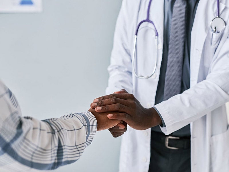 Patient and doctor shaking hands