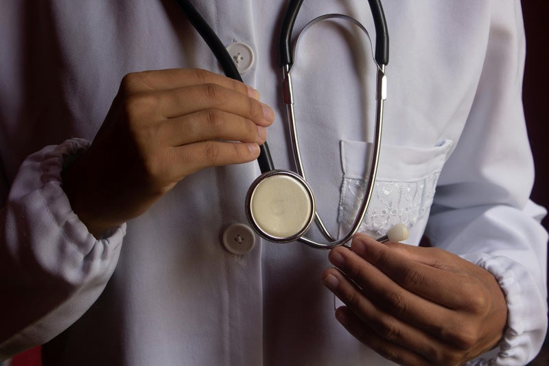 Doctor Hands Holding Stethoscope